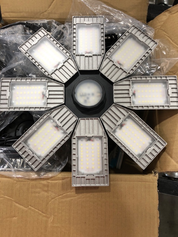 Photo 2 of  LED Garage Lights,150W 15000 Lumens Deformable Garage Ceiling Light with 6+1 Adjustable Panels, E26/E27 Base 6500K Daylight Led Shop Light for Garage Warehouse Workshop Basement