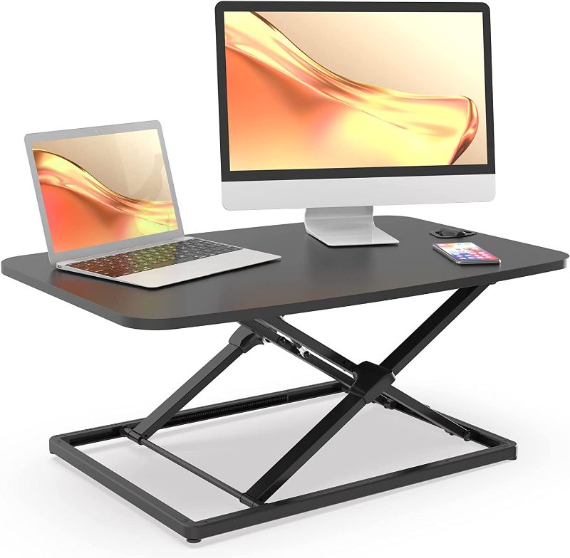 Photo 1 of JOY worker Standing Desk Converter, 31 Inch Compact Height Adjustable Stand up Desk Riser, Ultra Low Profile Sit to Stand Desk for Laptop Riser Workstation, Black 