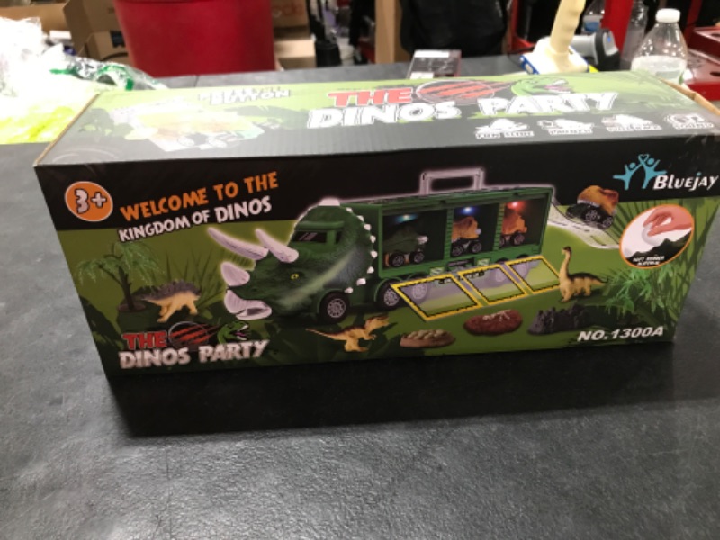 Photo 1 of BLUEJAY 21 Pack Dinosaur Toys for Kids 3-7, Dinosaur Truck with Oversized Dinosaur Map, Flashing Lights, Music and Roaring Sound, Kids Toys with 6 Pull Back Dinosaur Cars, 6 Dinosaur Toys (Green)