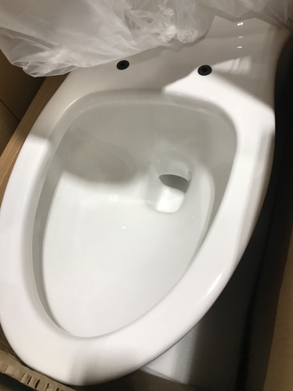 Photo 3 of 2-piece 1.1 GPF/1.6 GPF High Efficiency Dual Flush Complete Elongated Toilet in White, Seat Included
