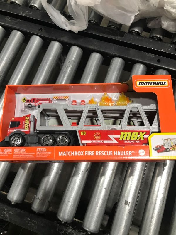 Photo 2 of ?Matchbox Fire Rescue Hauler Playset Themed Hauler with 1 Fire-Themed Vehicle, Holds 16 Cars, Easy-Release Ramp, 8 Accessories & Storage, for 3 & Up [Amazon Exclusive]