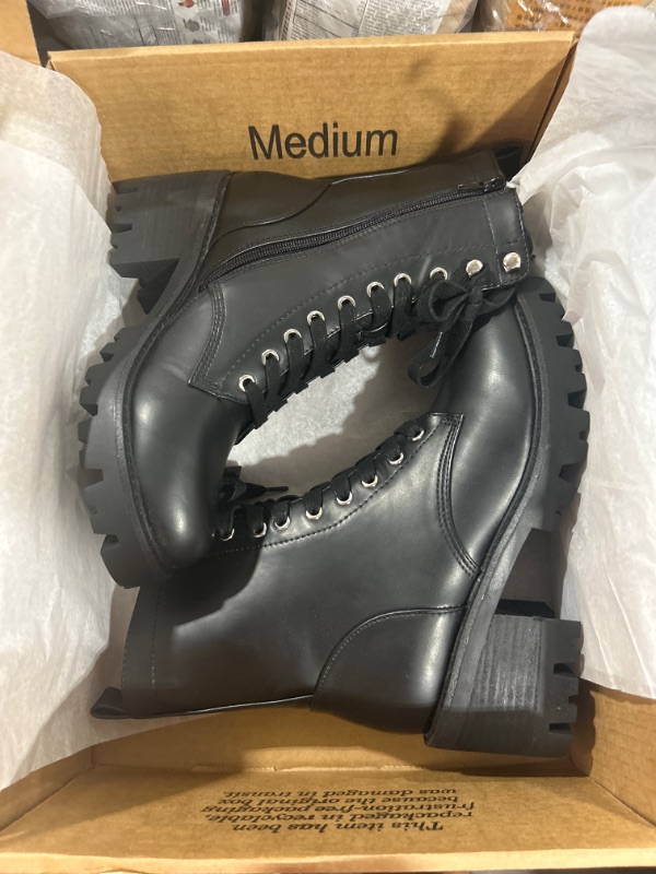 Photo 1 of BLACK COMBAT BOOTS SIZE 8 