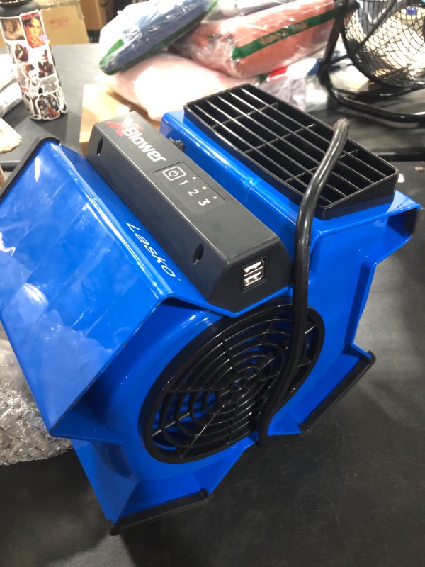 Photo 2 of Lasko X-Blower 6 Position High Velocity Pivoting Utility Blower Fan for Cooling, Ventilating, Exhausting and Drying, 3 Speeds, AC Outlet, Circuit Breaker with Reset, USB Port, 11", Blue, X12905
