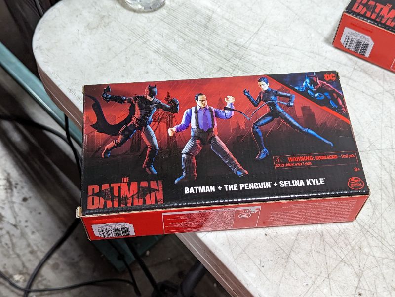 Photo 1 of DC Comics, Batman 3-Pack with Exclusive 4” Batman, Selina Kyle, The Penguin Action Figures, 3 Accessories, Batman Movie Kids Toys (Amazon Exclusive) Figures 3-pack