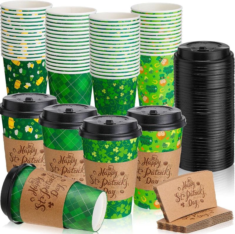 Photo 1 of 100 Pcs 12 oz St. Patrick's Day Disposable Coffee Cups with Black Dome Lids and Sleeves Lucky Shamrock Paper Cups Ireland Lucky Holidays Insulated Paper Coffee Cup for Hot Cold Drinks Party Supplies 