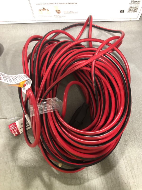 Photo 2 of 100 ft. 14/3 Indoor/Outdoor Extension Cord, Red and Black