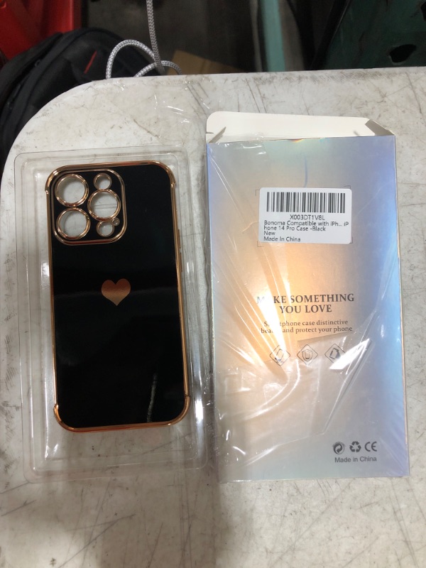 Photo 1 of iPhone 14 Pro Case - Gold & Black 