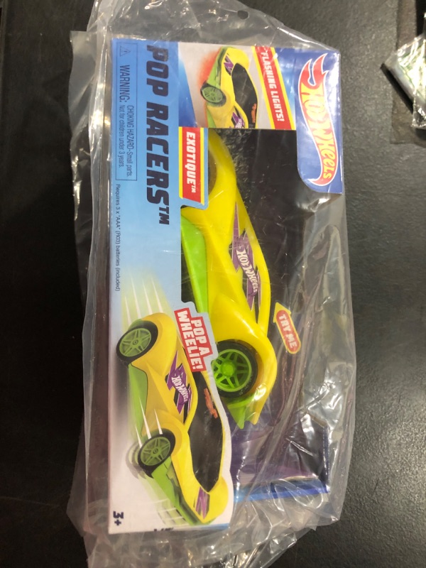 Photo 2 of Hot Wheels Pop Racers Car Exotique Toy Vehicle, 7-Inch Yellow Motorized Toy Car with Lights and Realistic Racing Sounds, Pops Wheelies, Kids Toys for Ages 3 Up, Gifts and Presents by Just Play