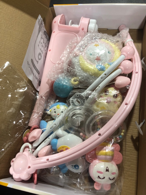 Photo 1 of BOBXIN Baby Musical Crib Mobile with Projector and Night Light,150 Music,Timing Function,Take Along Mobile Music Box and Rattle,Gift for Toddles(with Bibs) pink