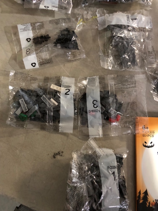 Photo 5 of **SOME LOOSE PIECES. MOST BAGS SEALED**
Nightmare Before Christmas Halloween Jack's and Sally Haunted House Building Set with Led Light (568pcs)