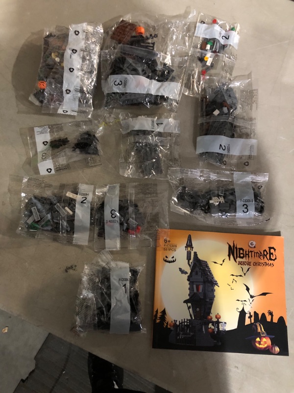 Photo 3 of **SOME LOOSE PIECES. MOST BAGS SEALED**
Nightmare Before Christmas Halloween Jack's and Sally Haunted House Building Set with Led Light (568pcs)