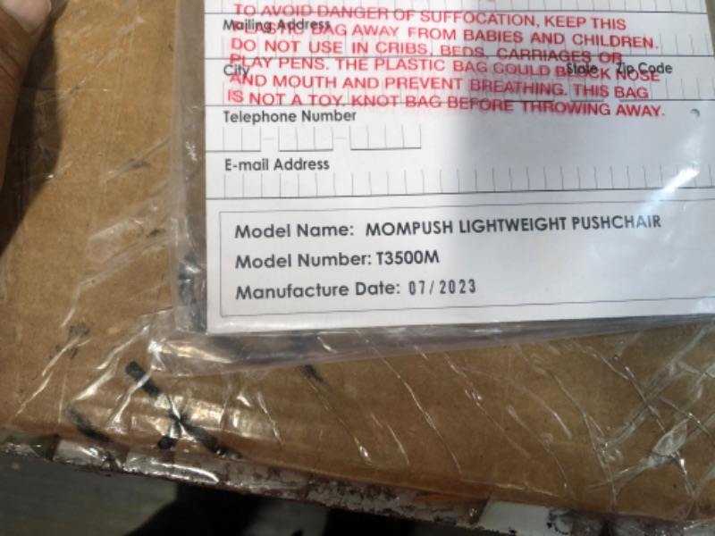 Photo 2 of Mompush Lithe V2 Lightweight Stroller + Snack Tray, Ultra-Compact Fold & Airplane Ready Travel Stroller, Near Flat Recline Seat, Cup Holder, Raincover & Travelbag Included Black