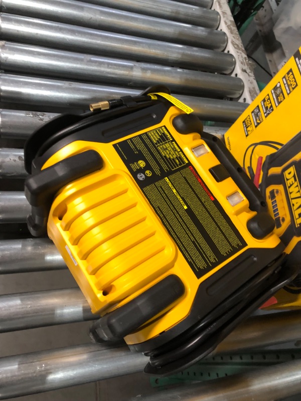 Photo 3 of DEWALT DXAEPS14 1600 Peak Battery Amp 12V Automotive Jump Starter/Power Station with 500 Watt AC Power Inverter, 120 PSI Digital Compressor, and USB Power , Yellow