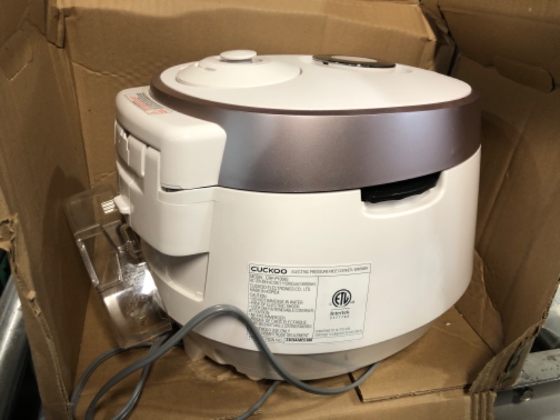 Photo 3 of ***MAJOR DAMAGE - BOTTOM CRACKED - POWERS ON - SEE PICTURES***
Cuckoo CRP-P1009SW 10 Cup Electric Heating Pressure Cooker & Warmer – (White), 12 Built-in Programs