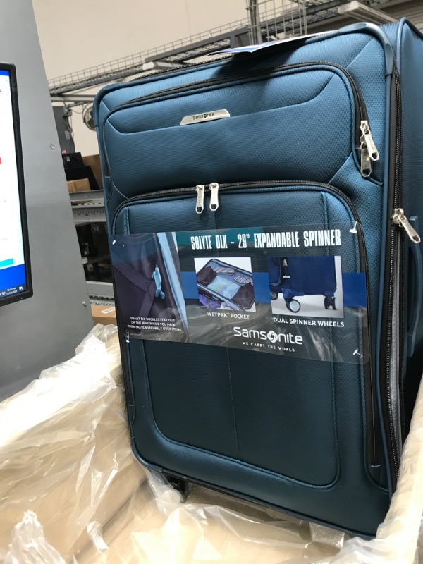 Photo 2 of ***USED - NO PACKAGING - DAMAGED - SEE COMMENTS***
Samsonite Solyte DLX Softside Expandable Luggage with Spinner Wheels, Mediterranean Blue, Checked-Large 29-Inch