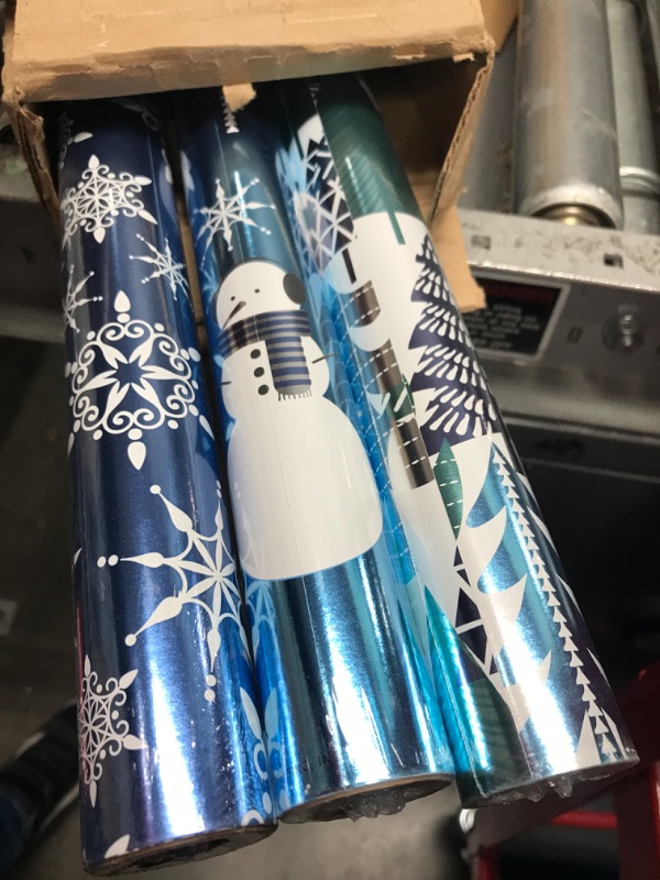 Photo 2 of Hallmark Blue Foil Christmas Wrapping Paper with Cut Lines on Reverse (3 Rolls: 60 sq. ft. ttl) Snowmen, Snowflakes, Christmas Trees Snowmen, Snowflakes, and Stripes