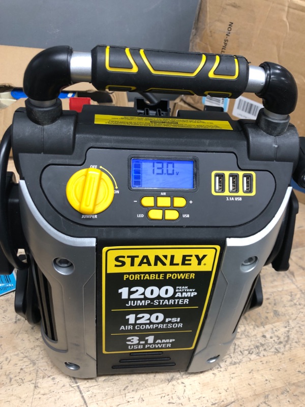 Photo 2 of **MISSING CHARGE CORD**
-STANLEY J5C09D Digital Portable Power Station Jump Starter: 1200 Peak/600 Instant Amps, 120 PSI Air Compressor, 3.1A USB Ports, Battery Clamps 1,200 Peak Amps