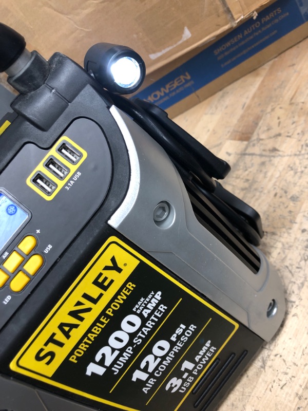 Photo 3 of **MISSING CHARGE CORD**
-STANLEY J5C09D Digital Portable Power Station Jump Starter: 1200 Peak/600 Instant Amps, 120 PSI Air Compressor, 3.1A USB Ports, Battery Clamps 1,200 Peak Amps