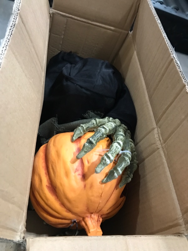 Photo 1 of Haunted Hill Farm Animatronic Scary Groundbreaker Pumpkin Head with Touch Activated Lights and Sounds, Battery Operated Indoor or Covered Outdoor Halloween Decoration 25" Jumping Pumpkin Groundbreaker
