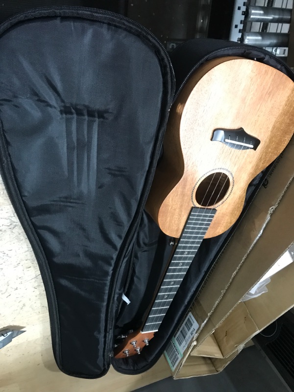 Photo 2 of Enya Concert Ukulele 23 Inch Solid Mahogany Top Ukelele for Beginner with Gig bag, Capo, Strap, Strings, Pick (EUC-25D Nature)