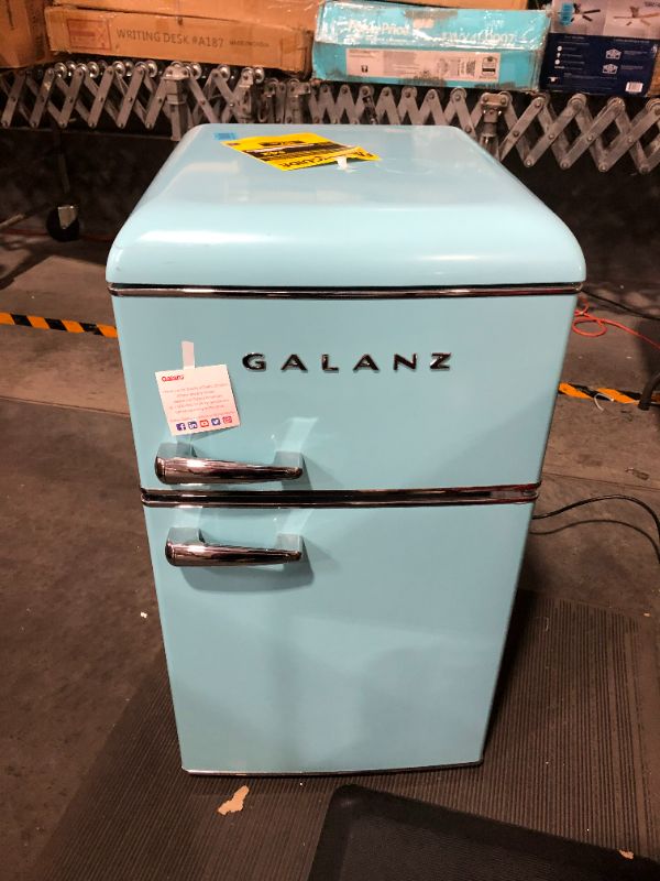 Photo 2 of ***DAMAGED - SCUFFED AND SCRAPED - USED AND DIRTY - POWERS ON***
Galanz Retro Compact Mini Fridge with Freezer, 2-Door, Energy Efficient, Light Blue