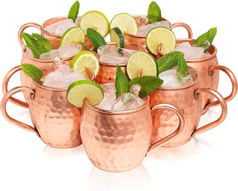 Photo 1 of  Moscow Mule Copper Mugs Set of 24 (16oz) | Food Grade Cups | Handcrafted w/Lacquered Hammered Finish, Smooth Rounded Lip, Ergonomic Handle  w/Solid Grip
