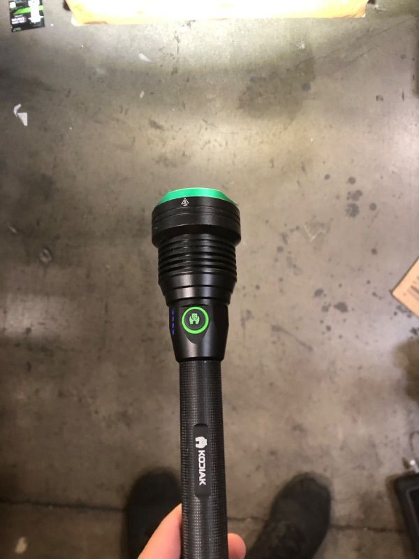 Photo 2 of Kraken Rechargeable Tactical Grade Flashlight with Power Bank, 6000 Lumens
