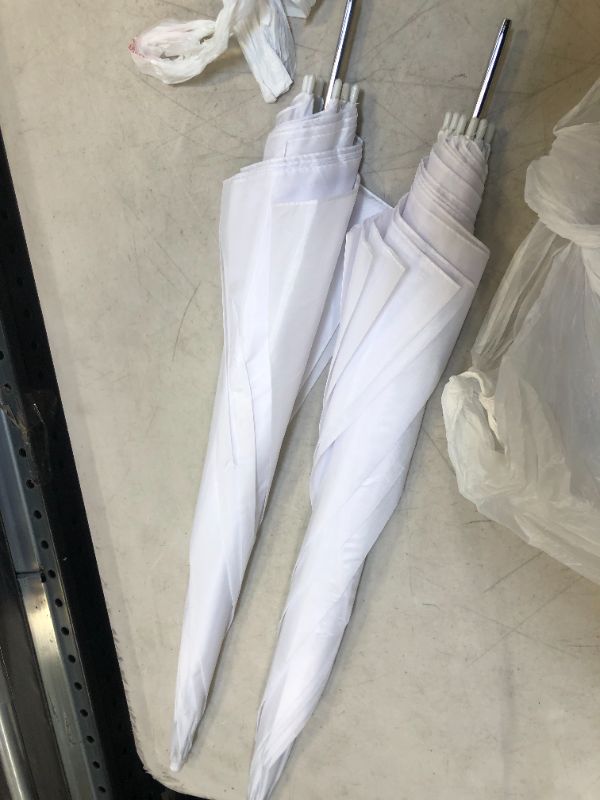 Photo 2 of A PAIR OF WHITE UMBRELLA WITHOUT HANDLE