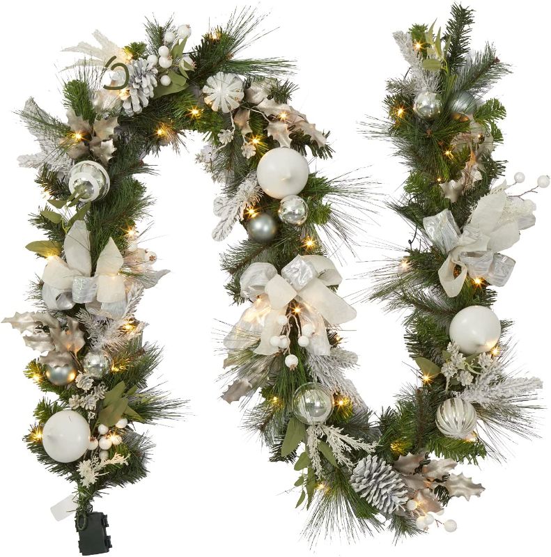 Photo 1 of Adeeing Christmas Garland with Lights, 9 ft Pre-lit Silver White Christmas Garland with Ball Ornaments Holly Leaves Battery Operated Lights for Outdoor Home Holiday Party Decor
