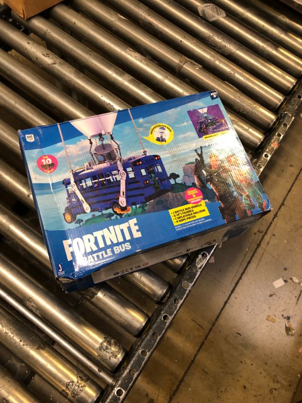 Photo 3 of Fortnite Battle Bus Deluxe - Features Inflatable Balloon with Lights & Sounds, Free-Rolling Wheels on Bus - Includes 4 Inch Recruit (Jonesy) and Exclusive Tomatohead Action Figures