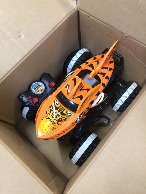 Photo 2 of Hot Wheels Monster Trucks, Remote Control Car, Monster Truck Toy with All-Terrain Wheels, 1:15 Scale Unstoppable Tiger Shark RC