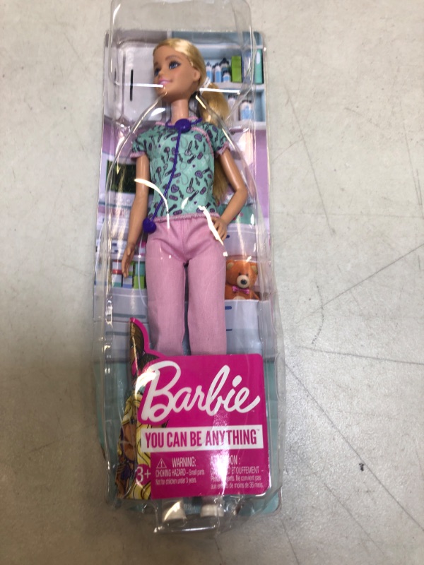 Photo 2 of Barbie Nurse Blonde Doll (12-in) with Scrubs Featuring a Medical Tool Print Top & Pink Pants, White Shoes & StethoscopeAccessory, Great Gift for Ages 3 Years Old & Up