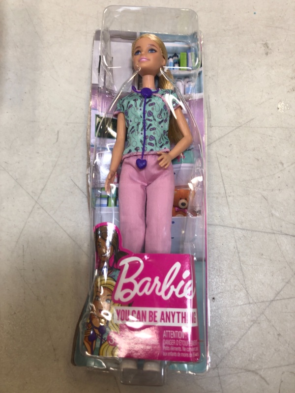 Photo 2 of Barbie Nurse Blonde Doll (12-in) with Scrubs Featuring a Medical Tool Print Top & Pink Pants, White Shoes & StethoscopeAccessory, Great Gift for Ages 3 Years Old & Up