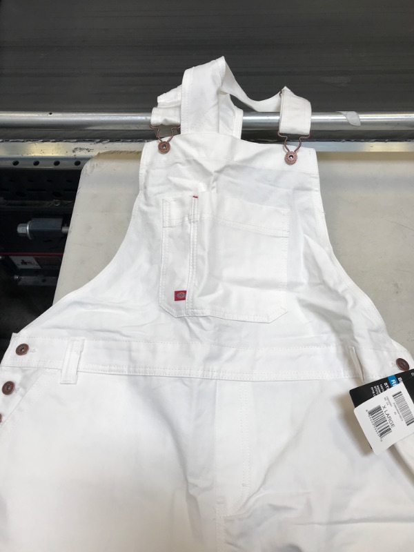 Photo 2 of Dickies Women's Denim Bib Overall
SIZE XL  (MAJOR STAIN IN THE BOTTOM)