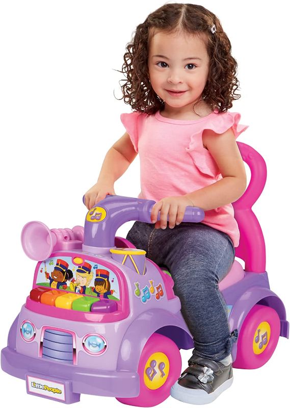 Photo 1 of Fisher Price Music Parade Purple Ride-On with 5 Different Marching Tunes! [Amazon Exclusive]
