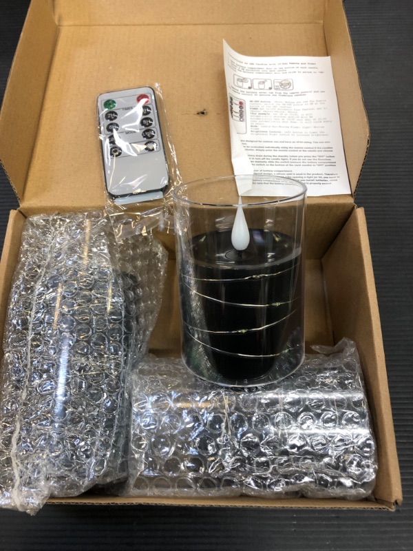 Photo 1 of Amagic Black Flameless Candles with Flickering String Lights, Battery Operated Candles with Starry Lights, Embedded String Light Candle with Remote and Timers for Halloween Decoration, Set of 3