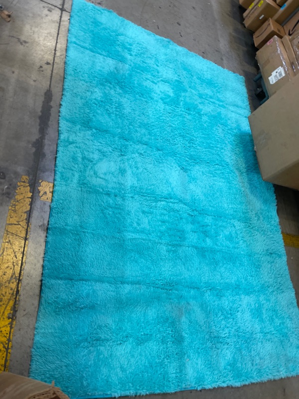 Photo 1 of 6' X 9' FAUX FUR TEAL RUG, DIRTY 