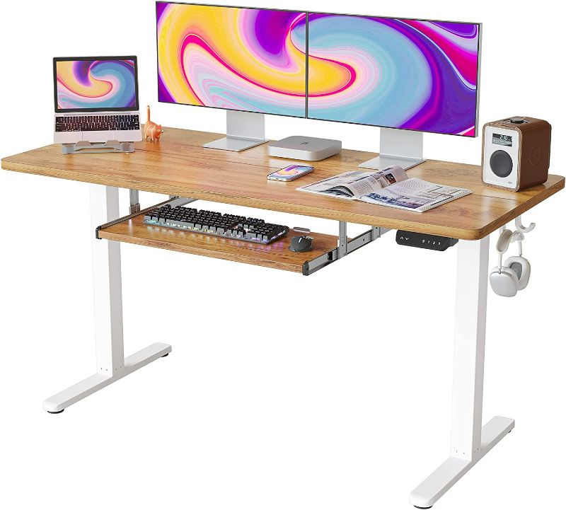 Photo 1 of FEZIBO 55-Inch Large Height Adjustable Electric Standing Desk with Keyboard Tray, 55 x 24 Inches Sit Stand up Desk with Splice Board, White Frame/Light Rustic Brown Top NEW 