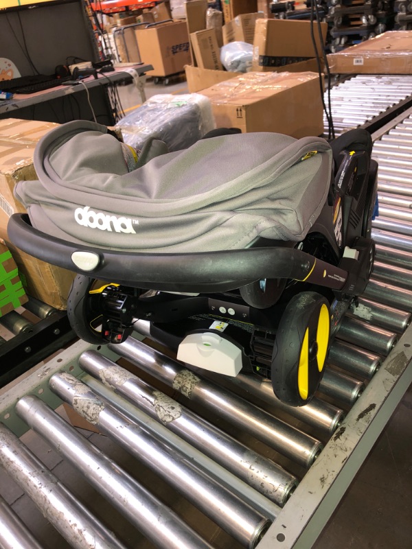 Photo 1 of Doona Infant Car Seat & Latch Base - Rear Facing, Car Seat to Stroller in Seconds - US Version, Greyhound
