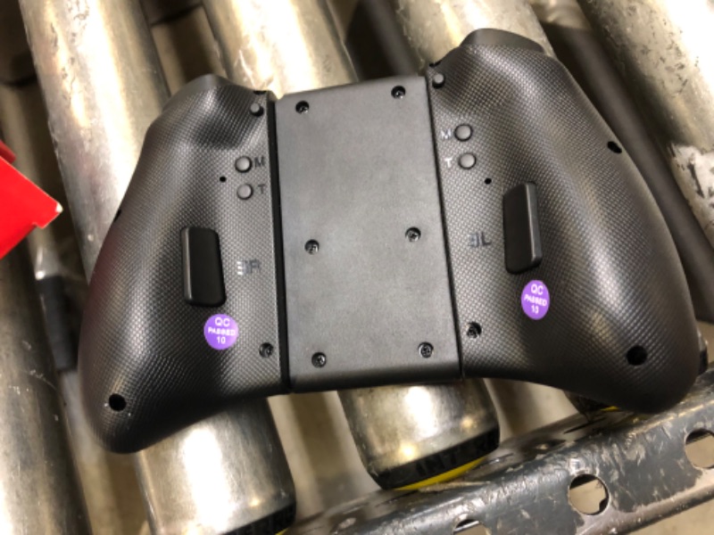 Photo 1 of NexiGo Wireless Joypad Controller for Nintendo Switch/Switch OLED, Joypad Controller with Vibration, Turbo, Mapping and LED Light (Cosmic Nebula) Black & Purple