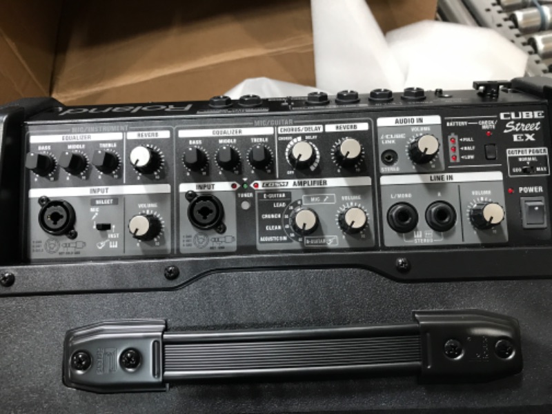 Photo 1 of Roland CUBE Street EX 4-Channel 50-Watt Battery Powered Amplifier & Amazon Basics Adjustable Boom Height Microphone Stand with Tripod Base, Up to 85.75 Inches - Black