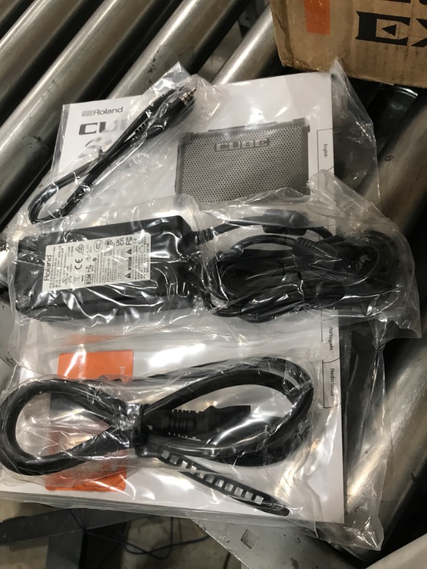 Photo 1 of Roland CUBE Street EX 4-Channel 50-Watt Battery Powered Amplifier & Amazon Basics Adjustable Boom Height Microphone Stand with Tripod Base, Up to 85.75 Inches - Black