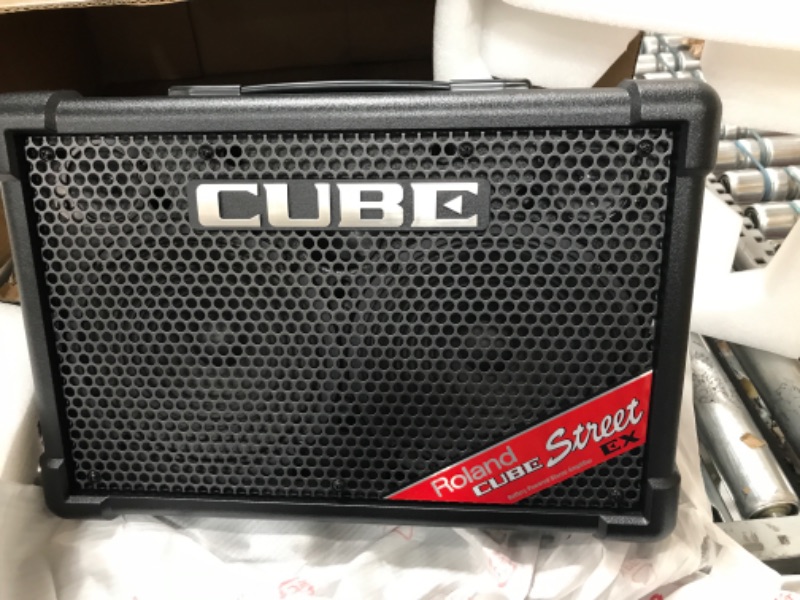 Photo 1 of Roland CUBE Street EX 4-Channel 50-Watt Battery Powered Amplifier & Amazon Basics Adjustable Boom Height Microphone Stand with Tripod Base, Up to 85.75 Inches - Black