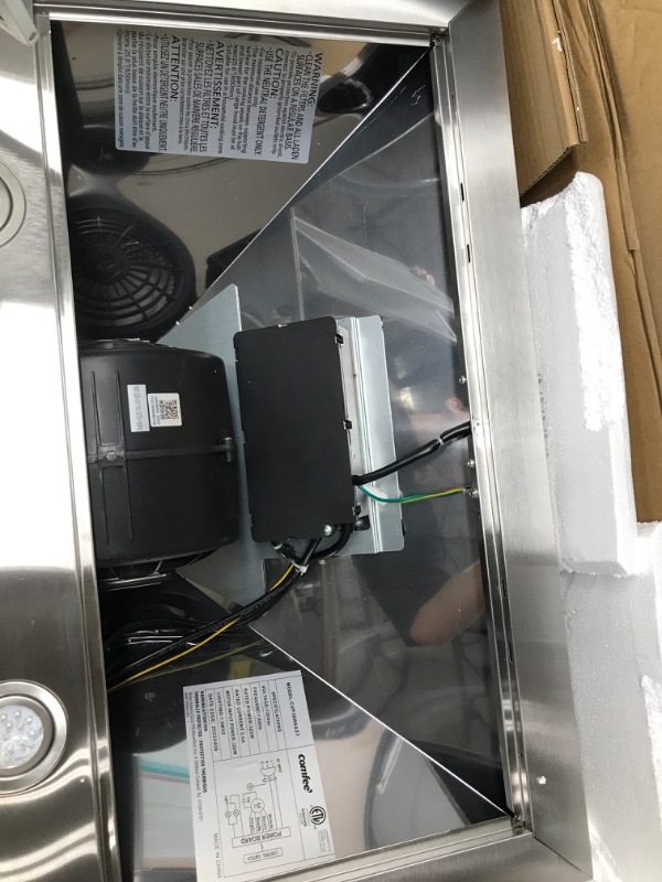 Photo 3 of ***Does not turn on and there is damage due to prior use, see pictures.*** 
Comfee CVP30W6AST Ducted Pyramid Range 450 CFM Stainless Steel Wall Mount Vent Hood with 3 Speed Exhaust Fan, 30 inches & CVG30W8AST 30 Inches Ducted Wall Mount Vent Range Hood