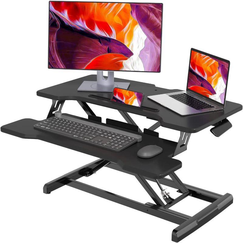 Photo 1 of Joy Seeker Standing Desk Converter 30 Inches Stand up Desk Riser, Height Adjustable Dual Tier Sit Stand Tabletop Monitor Riser Workstation for Home Office with Deep Keyboard Tray for Laptop
