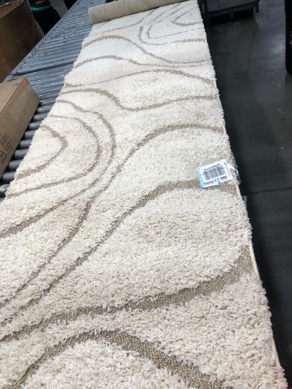 Photo 1 of 11ft tan and white home rug 