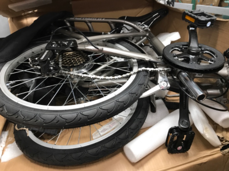 Photo 1 of **MINOR DAMAGE** Schwinn Loop Adult Folding Bike, 20-inch Wheels, 7-Speed Drivetrain, Rear Carry Rack, Carrying Bag, Multiple Colors Silver adult 7-speed Folding Bike