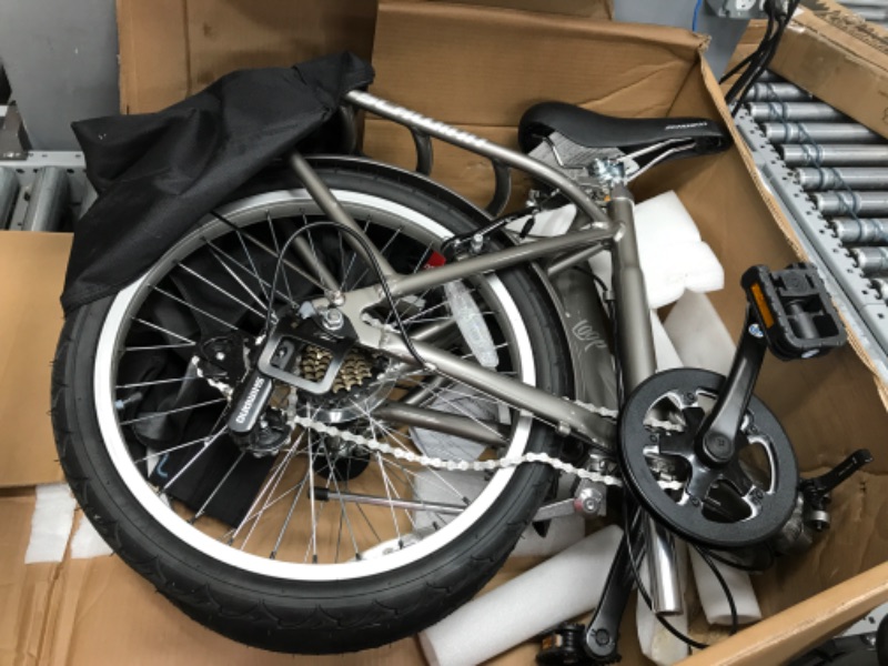 Photo 1 of **MINOR DAMAGE** Schwinn Loop Adult Folding Bike, 20-inch Wheels, 7-Speed Drivetrain, Rear Carry Rack, Carrying Bag, Multiple Colors Silver adult 7-speed Folding Bike