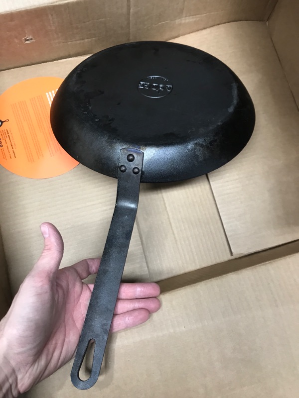 Photo 3 of **USED/MISSING HOLDERS**     Lodge CRS12 Carbon Steel Skillet, Pre-Seasoned, 12-inch & ASCRHH61 Silicone Hot Handle Holders for Carbon Steel Pans, Orange Black 12" Skillet + Handle Holders, Orange