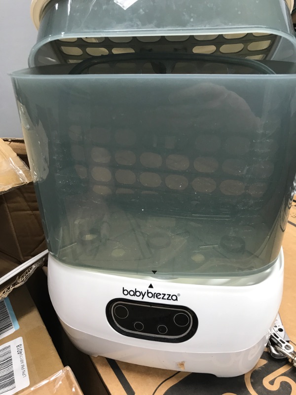 Photo 2 of Baby Brezza Baby Bottle Sterilizer and Dryer Advanced – Electric Steam Sterilization Machine – Universal Sterilizing for All Bottles: Plastic + Glass + Pacifiers + Breast Pump Parts - HEPA Filtration
**RETURNED ITEM*** works fine - tested